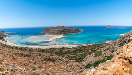 Panoramic view of Balos Lagoon near Chania, with magical turquoise waters, lagoons, tropical beaches of pure white, pink sand and Gramvousa island on Crete, Cap tigani, vivd colors. Greece