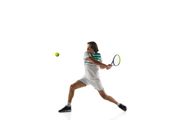Fototapeta na wymiar Achievement. Young caucasian professional sportsman playing tennis isolated on white background. Training, practicing in motion, action. Power and energy. Movement, ad, sport, healthy lifestyle