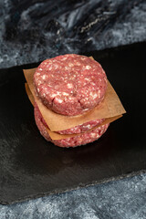 Minced beef meat for burger on black background