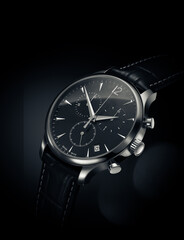 Close up view of automatic watch on black background with leather belt- 409209823