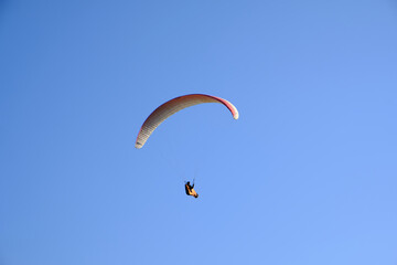 paragliding in the blue sky