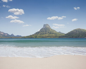 View of nice tropical beach with some island in the distance