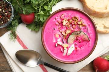 Delicious cold summer beet soup on table, flat lay