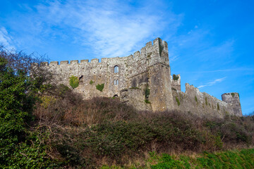 Fototapeta na wymiar Manorbier Castle in Pembrokeshire south Wales UK which is an 11th century Norman fort ruin and a popular travel destination tourist attraction landmark, stock photo image