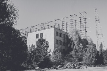 Moments footage of the apocalypse disaster after the explosion of the Chernobyl nuclear power plant the ruined city of Pripyat launched
Small destroyed building overgrown with a tree city of Pripyat
