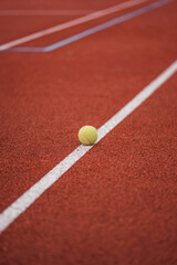 Tennis field and tennis ball on the flour 