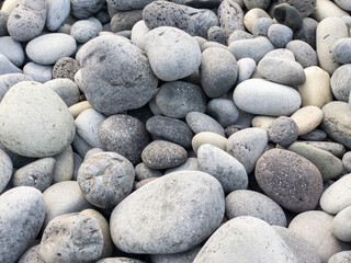 Different colors of pebbles on Reunion island east sea shore