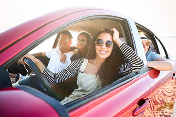 Happy friends together in car on road trip