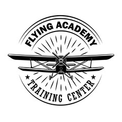 Flying academy emblem design. Monochrome element with biplane or retro airplane vector illustration with text. Pilot training school concept for labels and stamps templates © Bro Vector