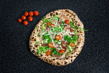 Fresh Rucola Pizza with parma ham and prosciutto
