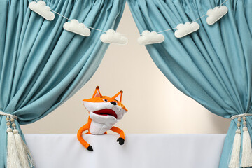 Naklejka premium Creative puppet show on white stage indoors