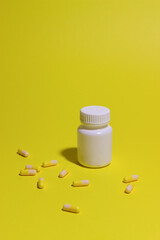 Pills on a yellow background. Medicine. Health. Medication.