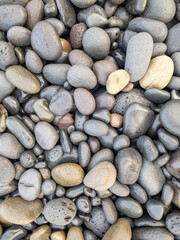 Different colors of pebbles on Reunion island east sea shore