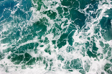 Abstract blue sea water with white wave
