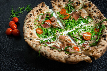 Fresh Rucola Pizza with parma ham and prosciutto
