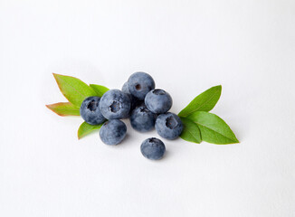 Blueberries with leaves on white background