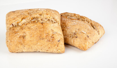 Fresh wholemeal roll isolated on a white background. View from another angle in the portfolio.