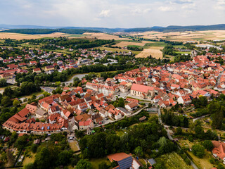 Fototapeta na wymiar Aerial view of the old town of the city Mellrichstadt in Germany, Bavaria on a late spring afternoon
