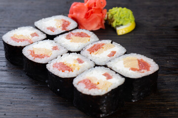 japanese sushi food. Maki ands rolls with tuna, salmon, shrimp, crab and avocado. Top view of assorted sushi. Rainbow sushi roll, uramaki, hosomaki and nigiri.