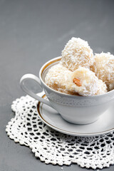 Delicious no-bake sweets, white chocolate truffles topped with grated coconut