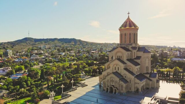 Aerial side view of Holy trinity cathedral in capital city Tbilisi. Third tallest eastern orthodox cathedral in world. Architecture of churches in caucasus concept