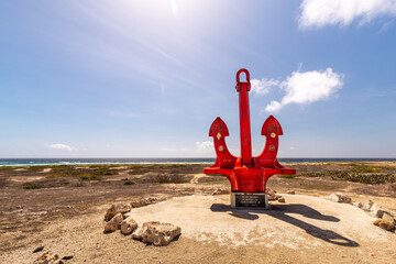 Large red anchor on Aruba's southeastern coast