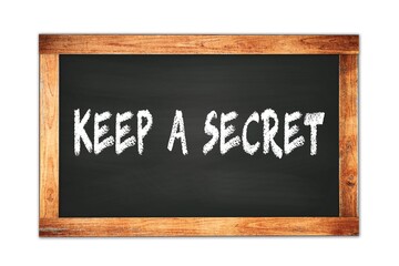 Obraz premium KEEP A SECRET text written on wooden frame school blackboard.
