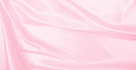 Smooth elegant pink silk or satin texture as wedding background. Luxurious background design