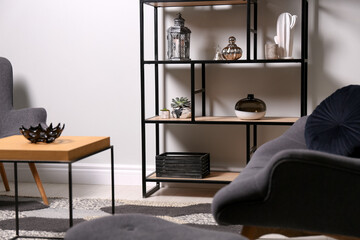 Stylish room with armchairs, coffee table and shelving. Interior design