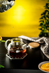 brewing tea, pouring boiling water into the kettle