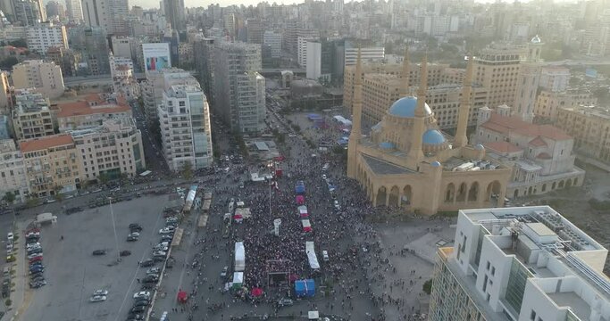 Beirut, Lebanon 2019 : day drone shot in Martyrs' Square, during the Lebanese revolution, with a few hundreds of protesters revolting against government corruption and economic crisis 