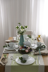 Beautiful Easter table setting with festive decor indoors