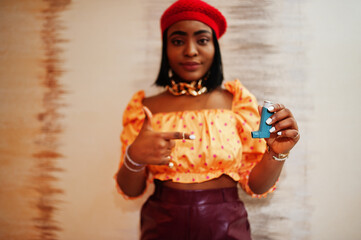 Young african american woman using asthma inhaler. Suffering sickness attack.