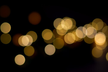 blurry yellow round lights on a dark background