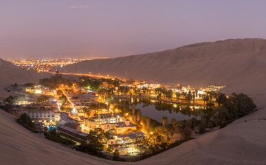 The Huacachina oasis at night in the Ica desert, Peru