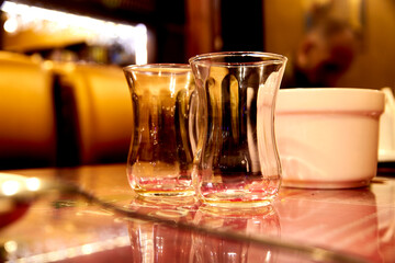 selective focus on two empty turkish tea glasses