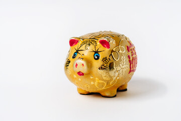 Golden piggy bank with Chinese characters on white background, Chinese New Year