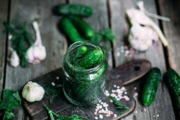 Obraz na płótnie Canvas Cucumbers in a jar The process of pickling fresh cucumbers.
