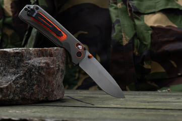 The reverse side of the knife with a clip for carrying. EDC knife.