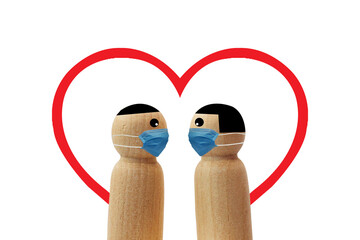 Wooden little figures with mask love on white background.Valentine concept.