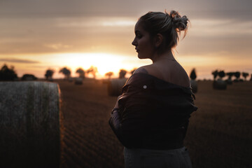 girl at sunset on field