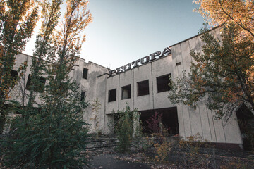 Fototapeta na wymiar Moments footage of the apocalypse disaster after the explosion of the Chernobyl nuclear power plant the ruined city of Pripyat launched destroyed building overgrown with a tree city of Pripyat 