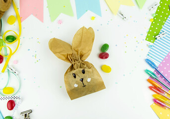DIY and kids creativity. Step by step instructions: how to make an Easter bunny packaging from a craft bag. Step7. Easter handmade craft.