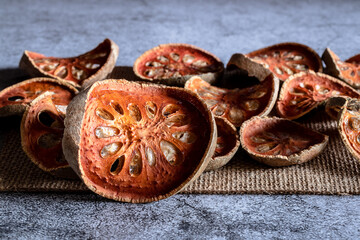 Dehydrated Bael on a Gray Marble Table