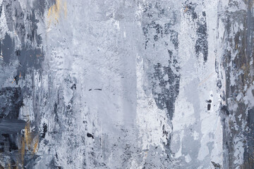 Textured wall with gray and golden colors.