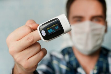 Pulse Oximeter, finger digital device to measure oxygen saturation in blood. Reduced oxygenation is...