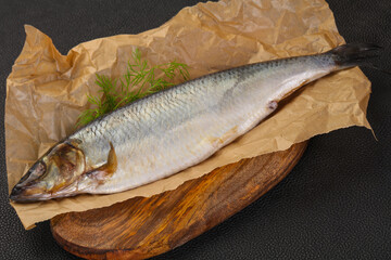 Salted herring over the wooden board