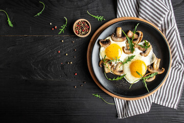 Fresh Organic Eggs Fried with Mushrooms. Delicious breakfast or snack. menu recipe place for text, top view