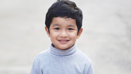 Cute Asian child. Little boy 3 year old smile do a happy face concept