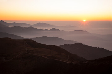 Sun rising up in mountains, Indian Himalayas